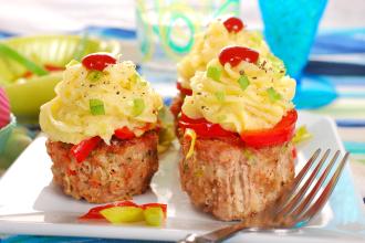Top these tasty meatloaf muffins with mashed potatoes for a savory surprise.