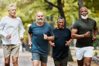 Group of senior men jogging together in the park