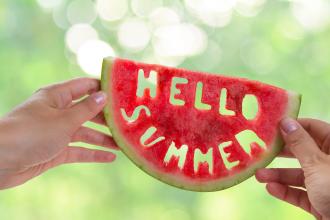 Hello summer letters carved in a watermelon slice